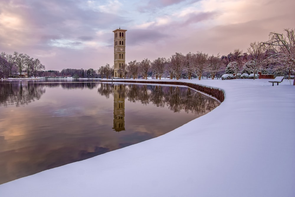 tower near lake during daytime