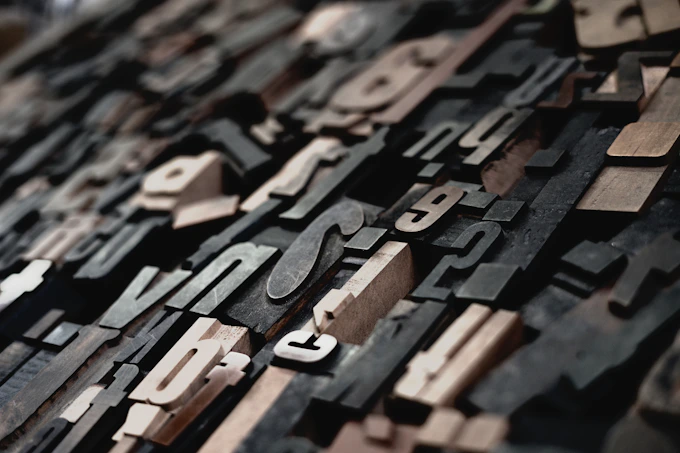 Close-up of antique letterpress type blocks and decorative printing ornaments