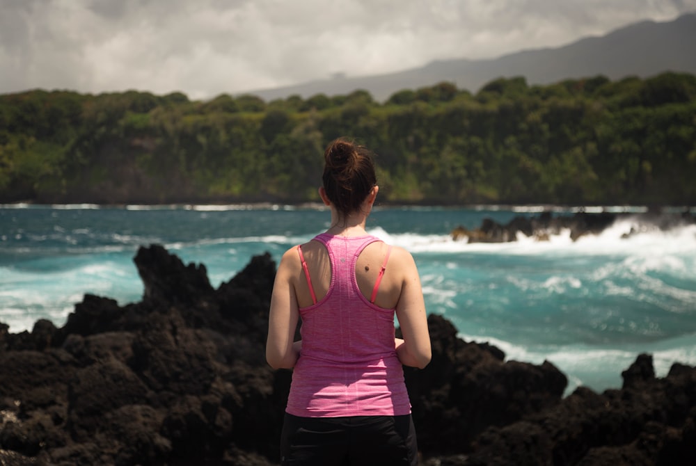 person standing on rock