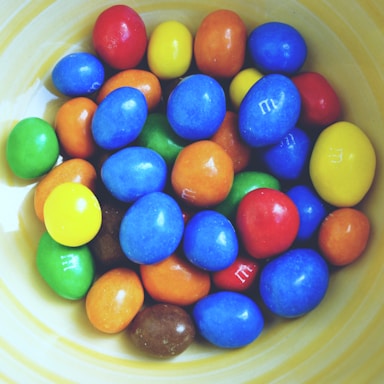 A vibrant assortment of various candies displayed in bowls.