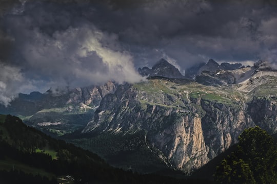 bird's eye view of mountains under nimbus cumulus clouds in Sella Pass Italy