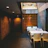 Cozy modern dining area with warm lighting and minimalist decor at Los Padrinos restaurant.
