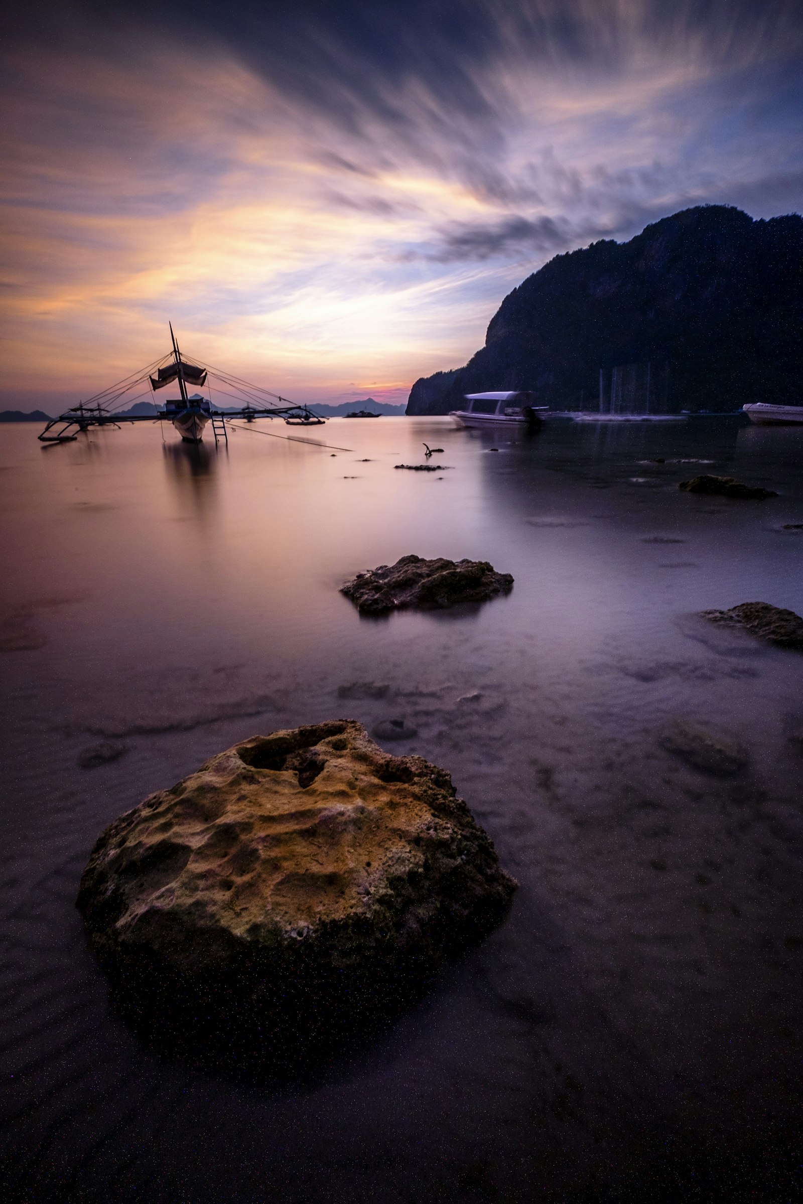 Fujifilm XF 10-24mm F4 R OIS sample photo. Boat near boulders and photography