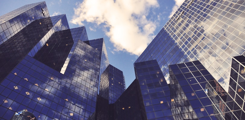 low angle photo of curtain wall building