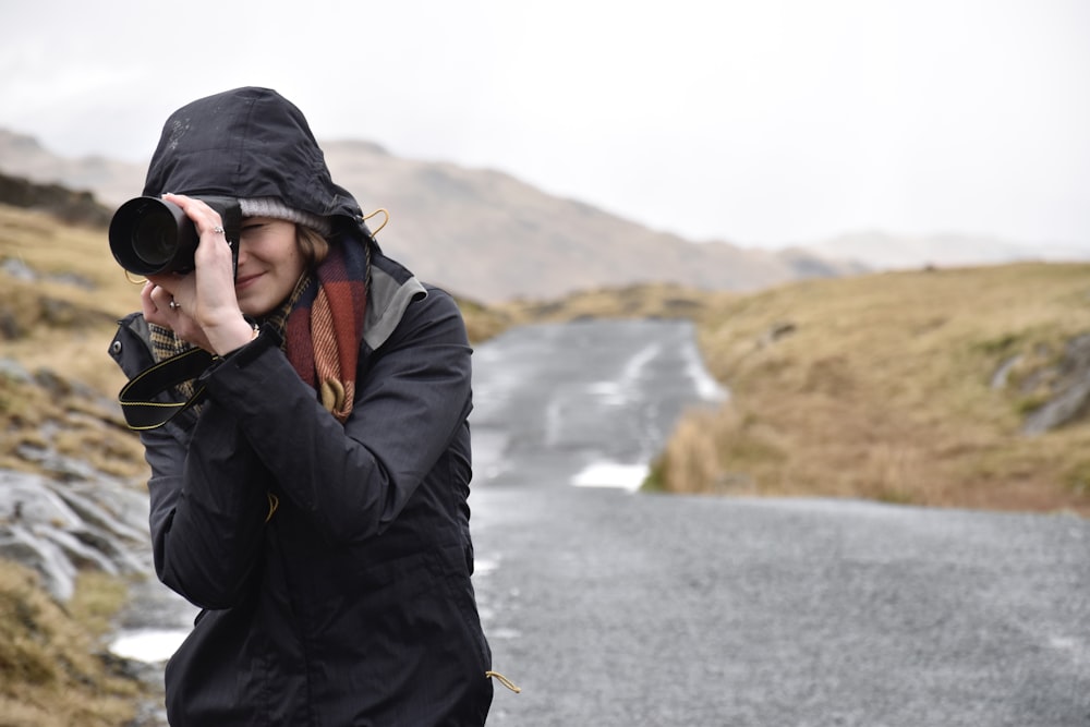 photo of woman taking pictures