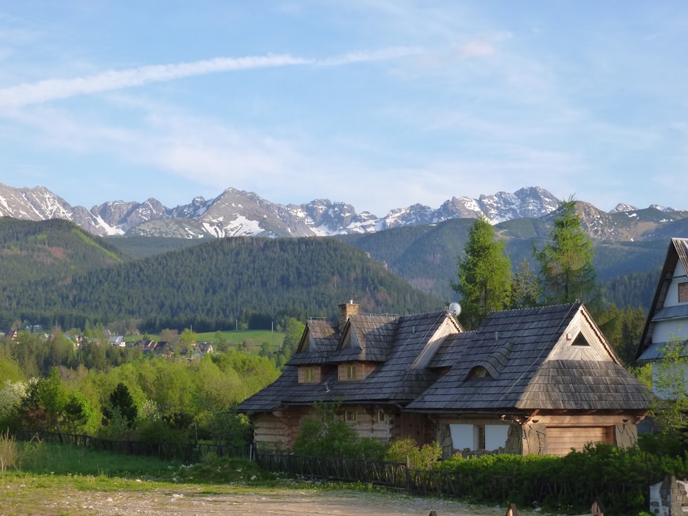 a house with mountains in the background