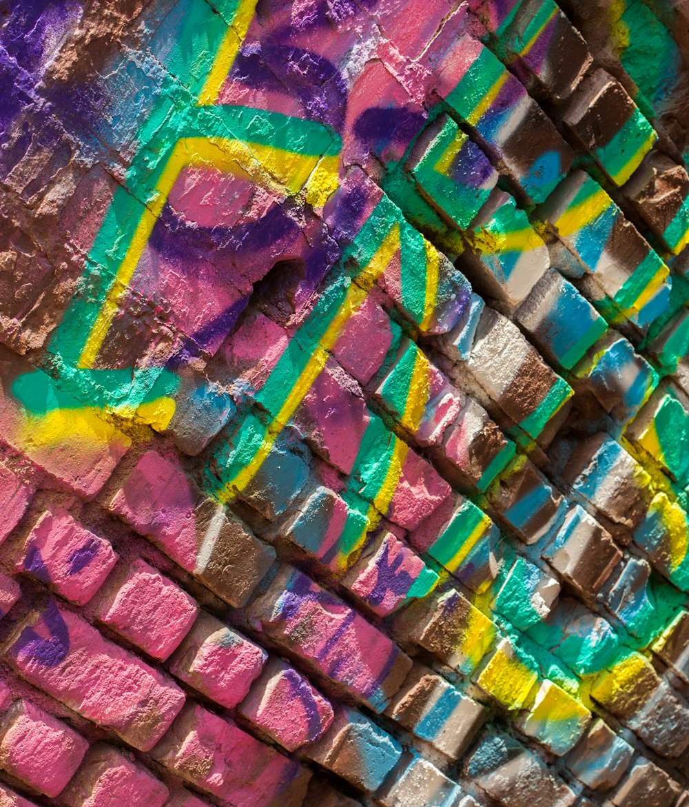 Writing on a painted brick wall.