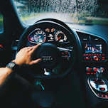 black Audi vehicle steering wheel