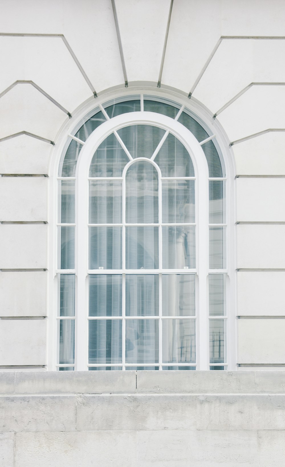 glass window with white steel frame