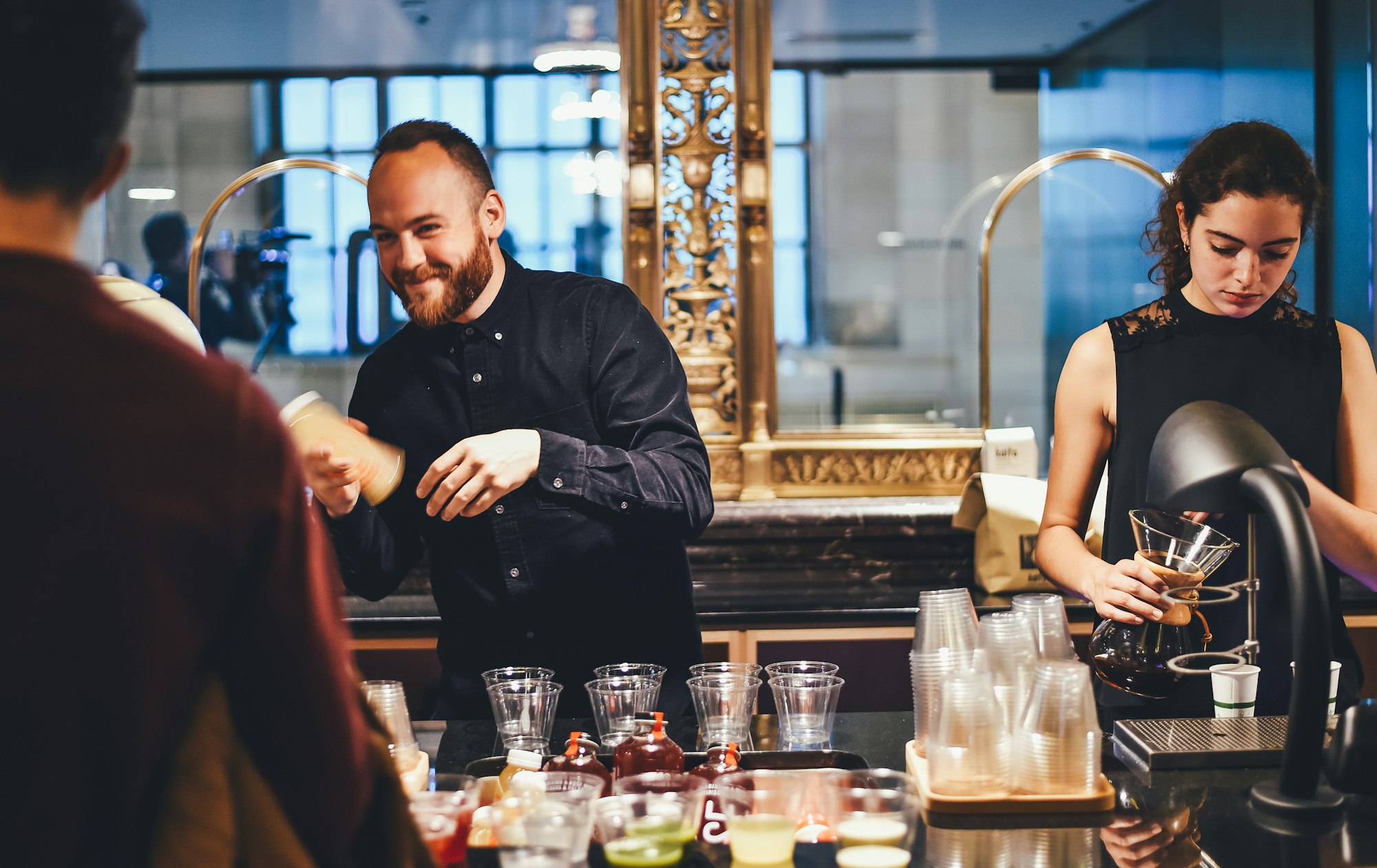 Restaurant bartenders serving cocktails