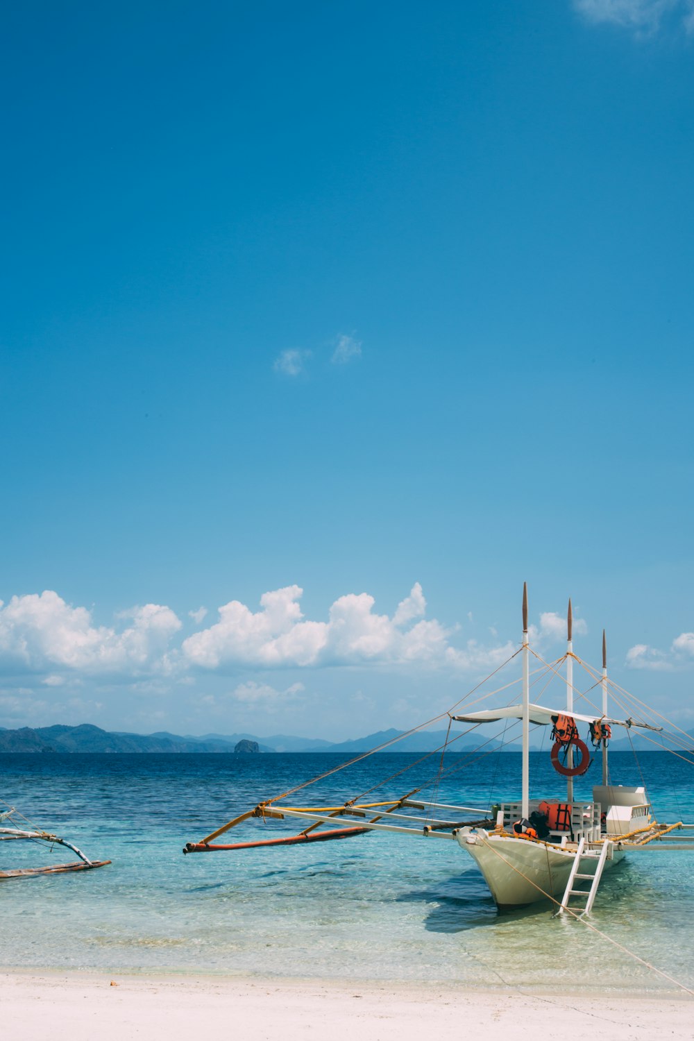 white wooden boat