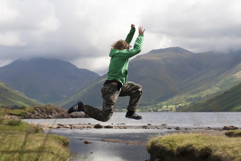 person jumping cliff