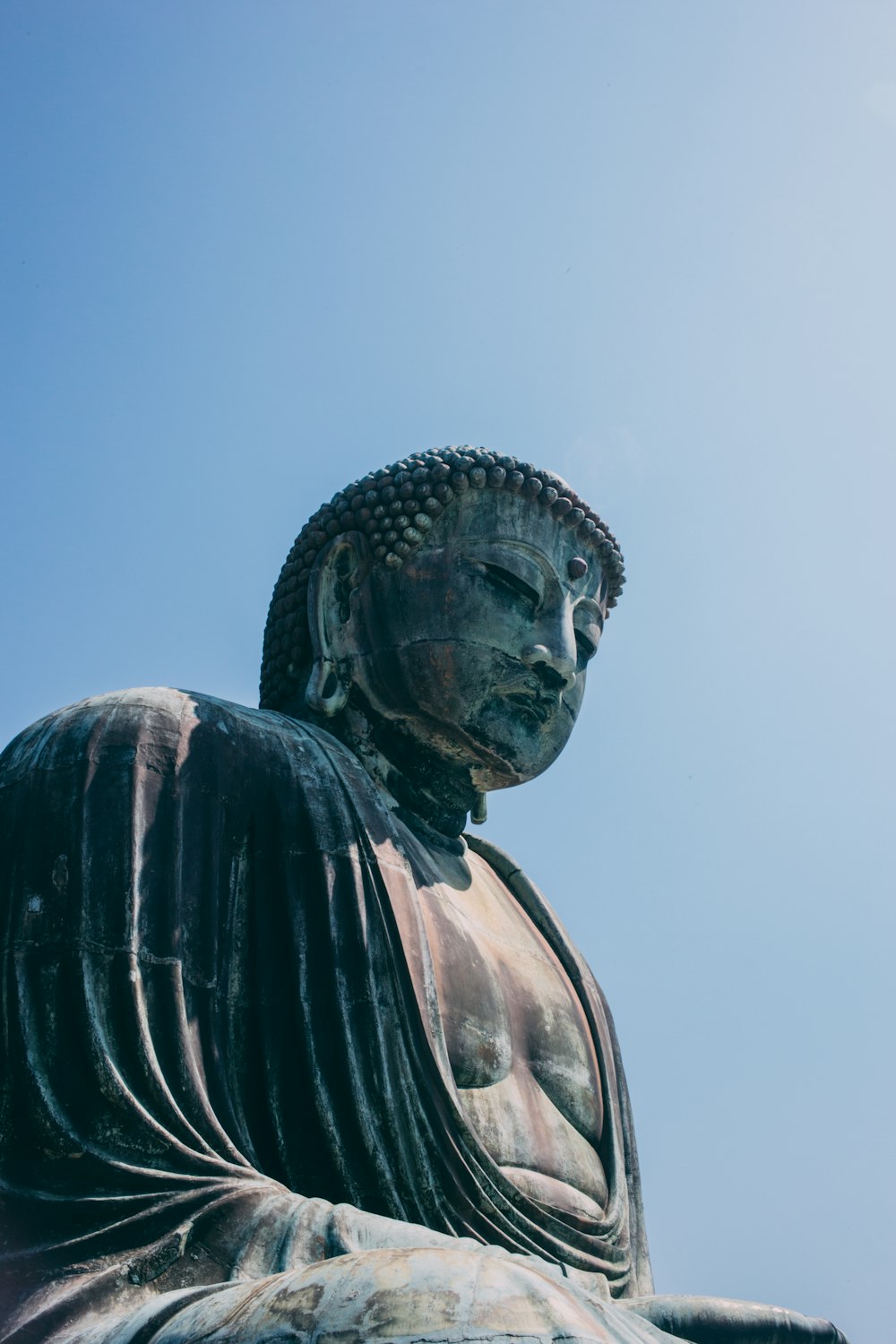 selektive Fokusfotografie der Buddha-Statue bei Tag