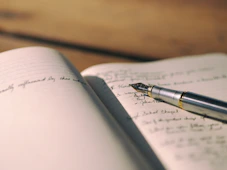 pen on white lined paper selective focus photography