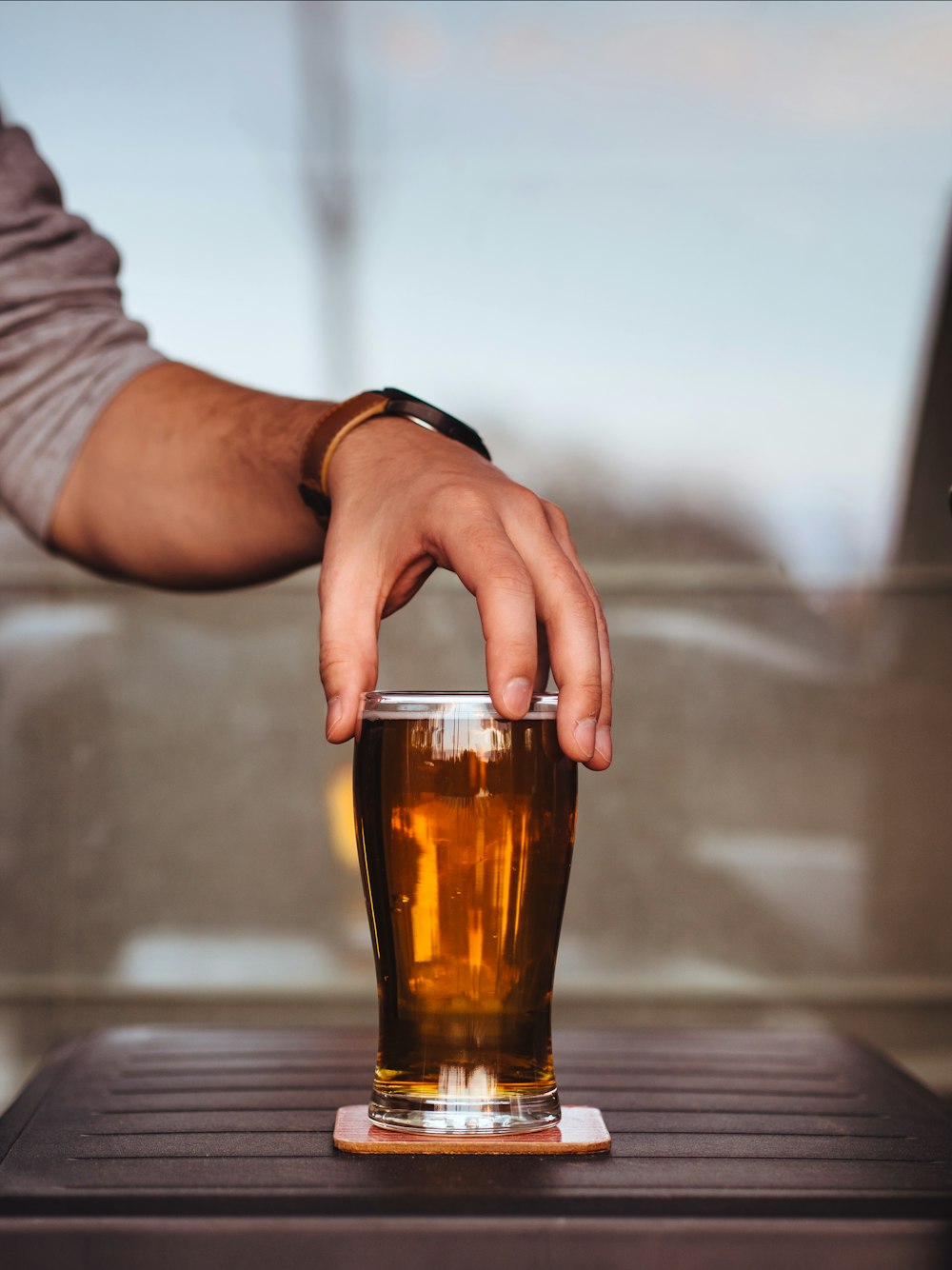 person holding glass cup