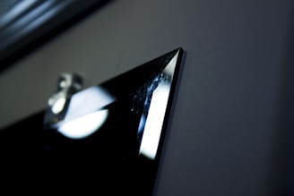 Close-up of a vibrant custom metal print with a brushed finish hanging on a wall.