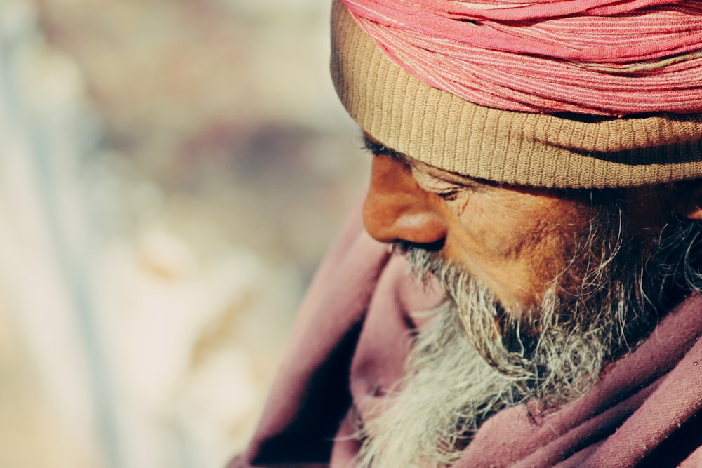 old man wearing traditional suit during daytime