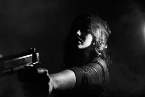 Black and white image of a film noir masterpiece with dramatic shadows and a femme fatale.