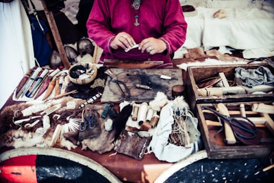 person in pink top infront of accessories craftsman google meet background