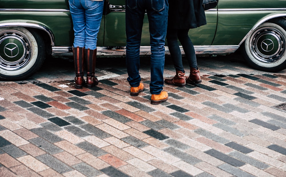 group of people standing on tiled surface