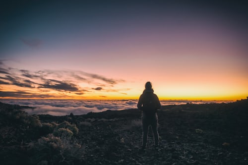 person standing on a mountain