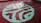 A swimming pool with clear, rippling water reflecting the light. At the bottom, a large, abstract design is visible, featuring a combination of green and aqua hues against a red-tiled background.