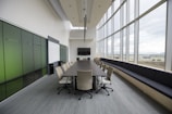 rectangular brown wooden table with chair lot inside building