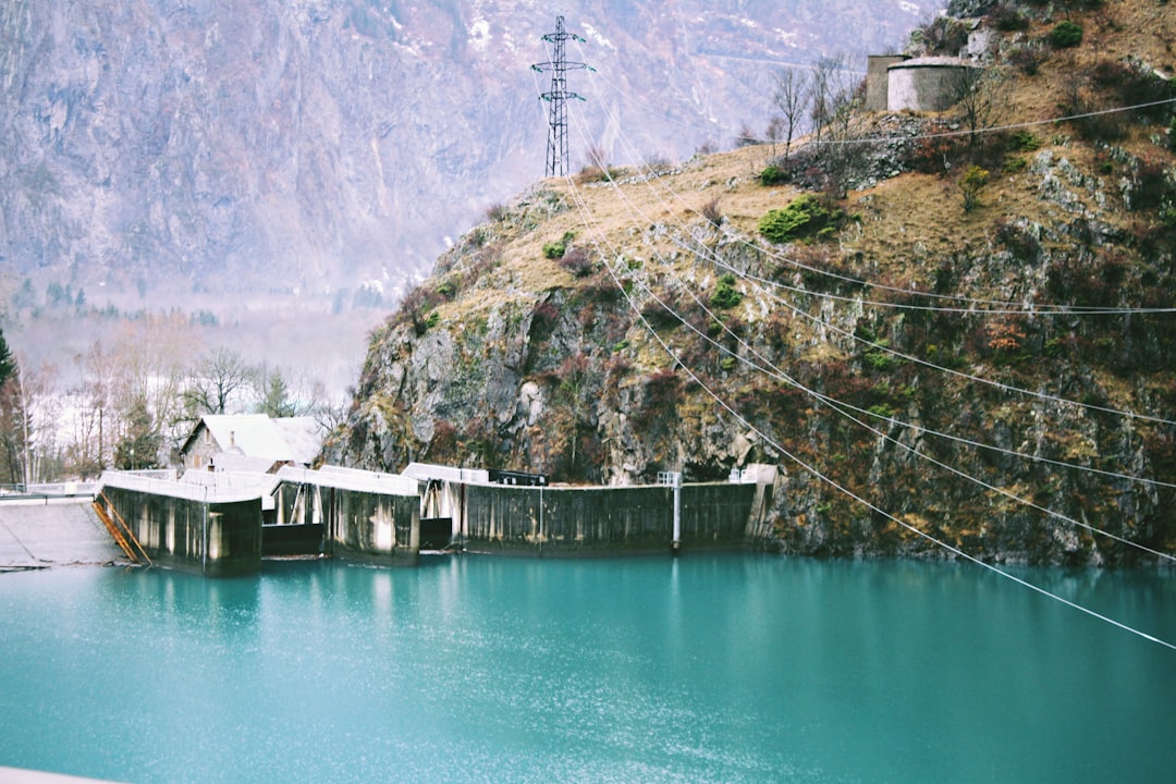 body of water beside cliff