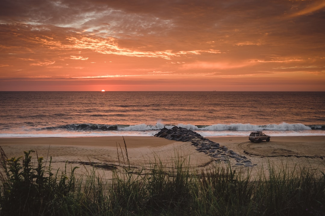 vehicle on shore at golden hour, Dawn patrol at the Delaware beaches.