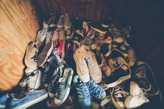 photography of assorted-color shoes lot on box