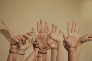 Close-up of hands in a motivating high-five after a fitness dance routine