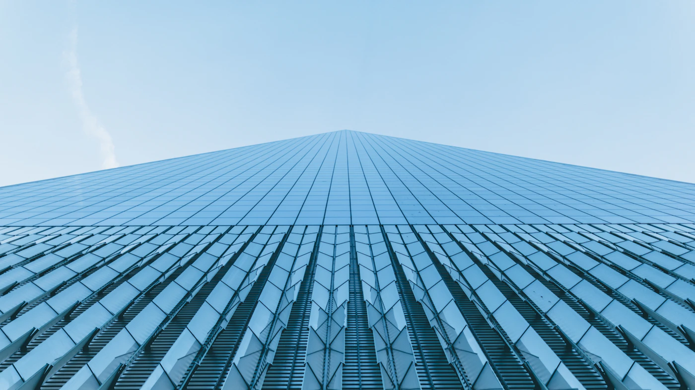 Looking up at a glass office tower