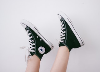 black and black and white Converse All Star high-top sneakers