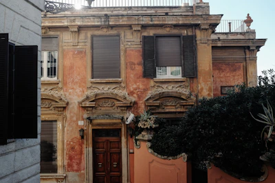 Muted architectural detail of a classic European building facade in soft shadows.