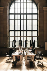 A welcoming office space with Team Rolph members consulting clients over property plans.