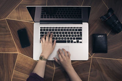 Hands practicing on a laptop keyboard in a guided exercise