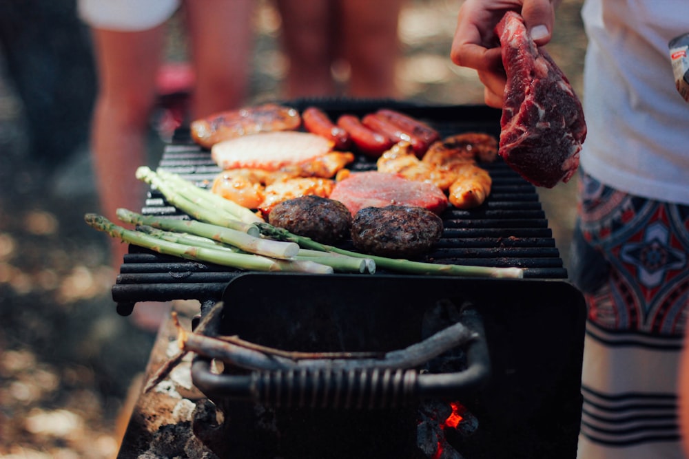 person grilling meat