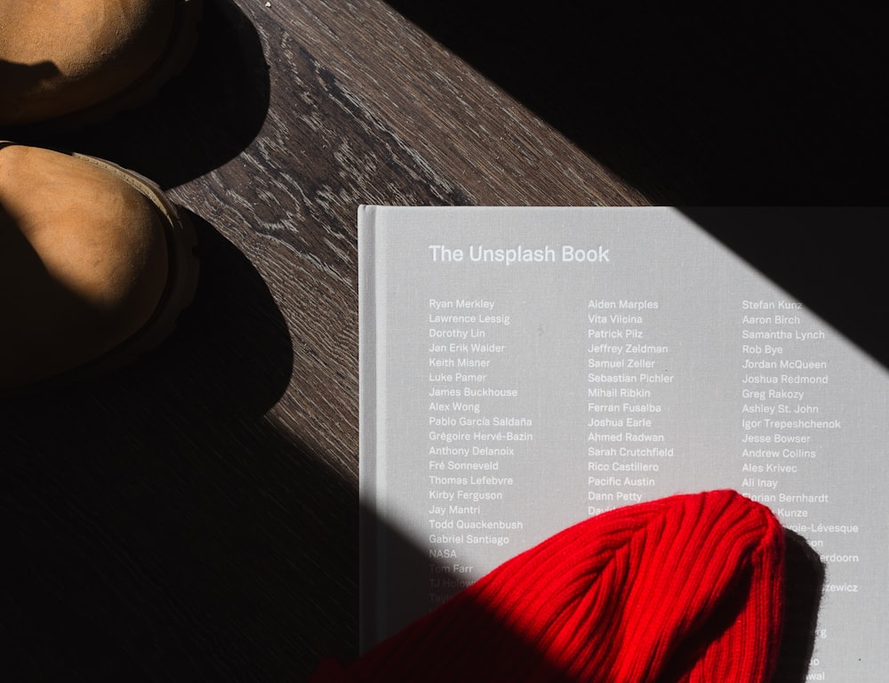 photo of The Unplash book on brown wooden surface