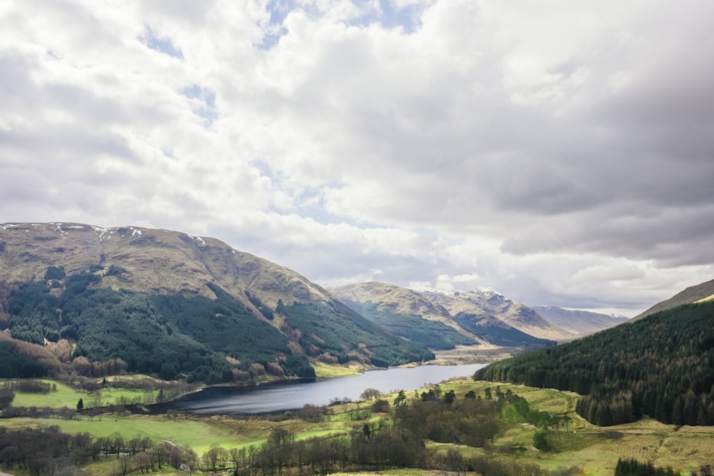 landscape photography of a mountain under gray clouds