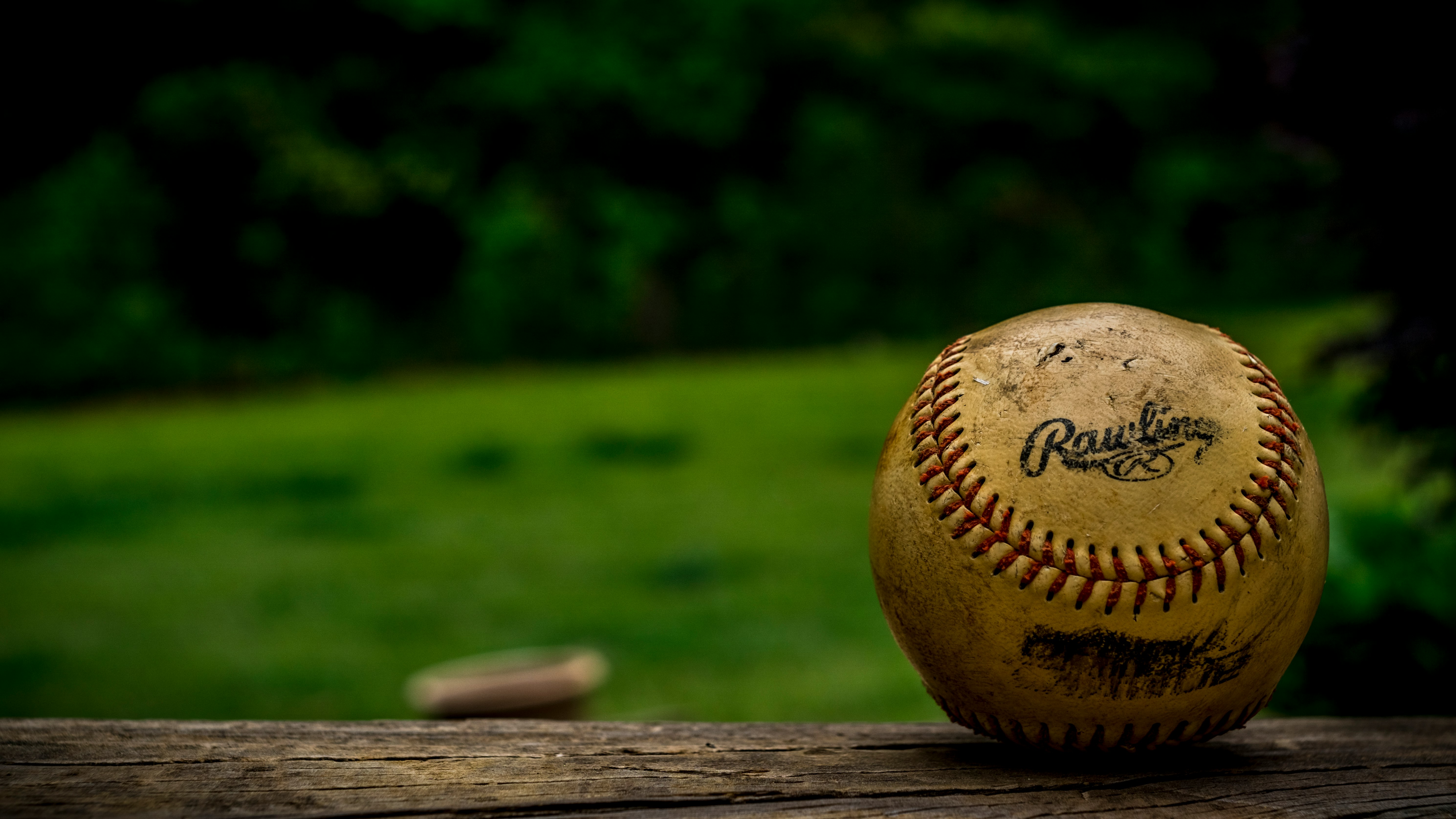 shallow focus photography of baseball