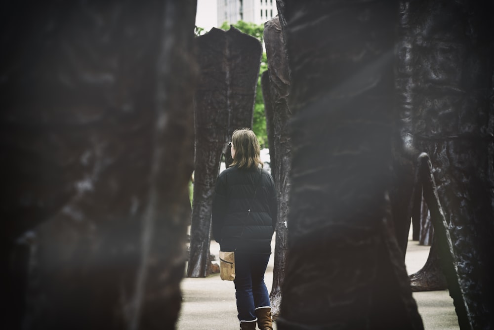 woman standing beside monument