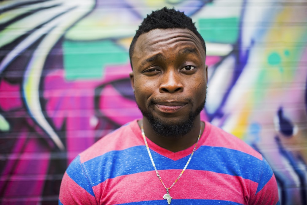 black haired man making face