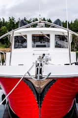 red and white motorboat