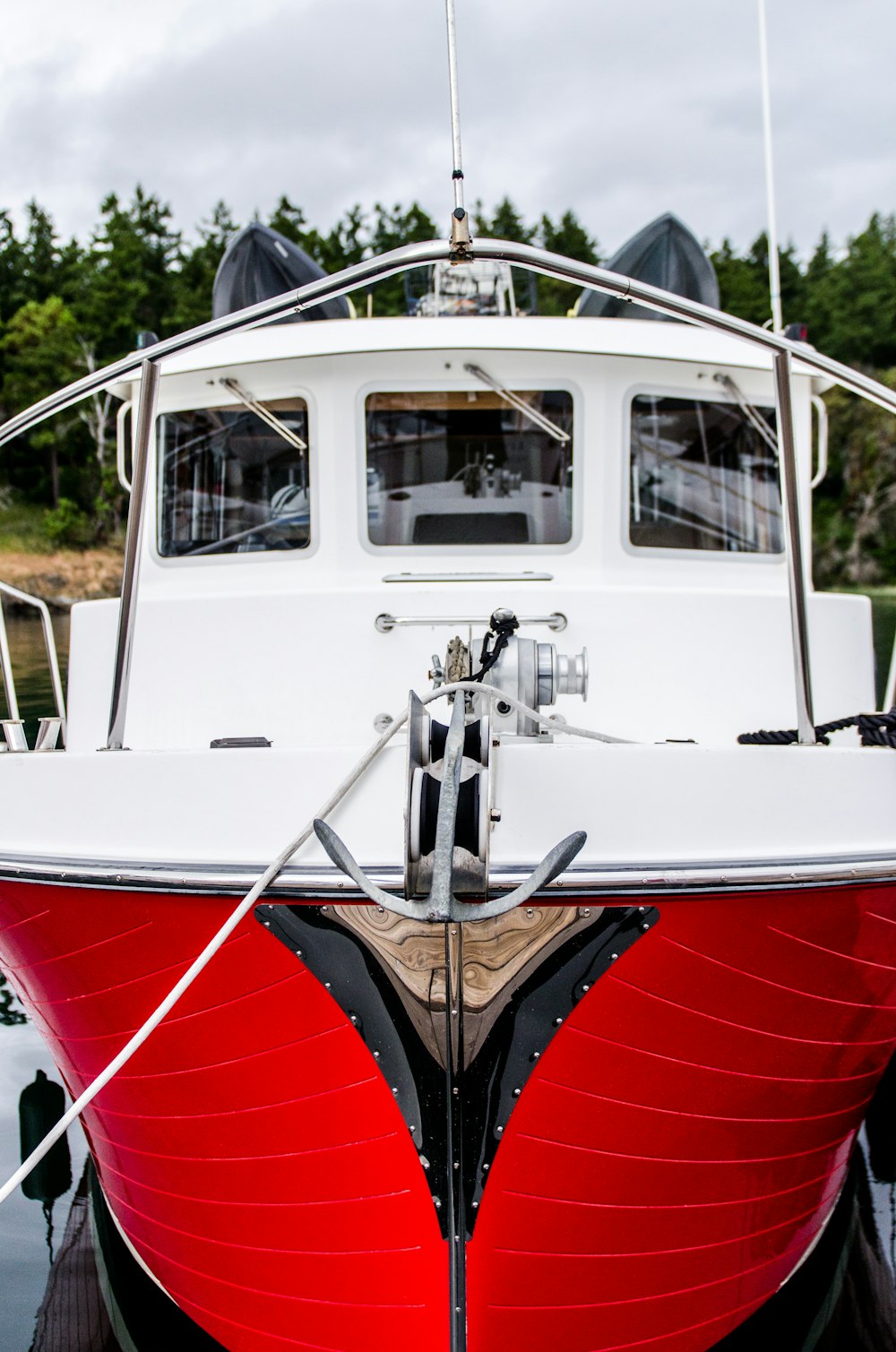 red and white motorboat