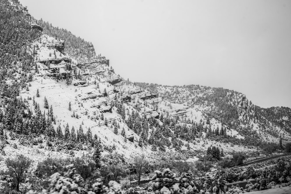 a snow covered mountain with a ski lift on top of it