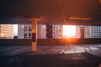 Evening view of a well-lit axial parking space with yellow and blue accents.
