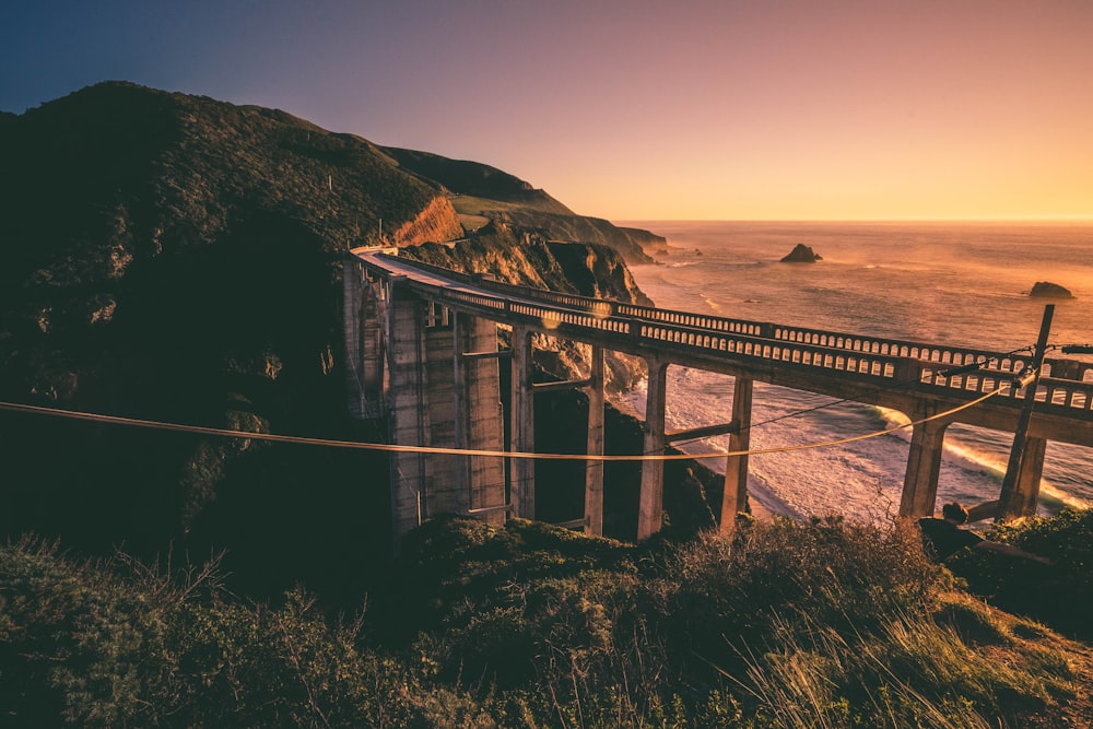 landscape photography of bridge near mountain