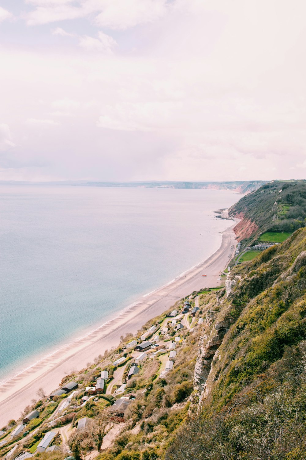 aerial view photography of body of water with houses beside the shore