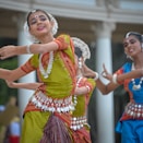 three woman performing traditional dance