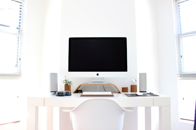 iMac on top of table